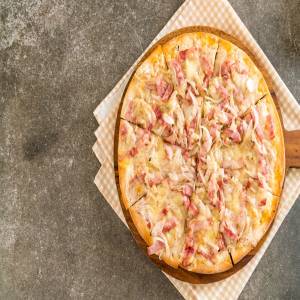 4 astuces pour réussir une tarte flambée alsacienne à la maison Munster